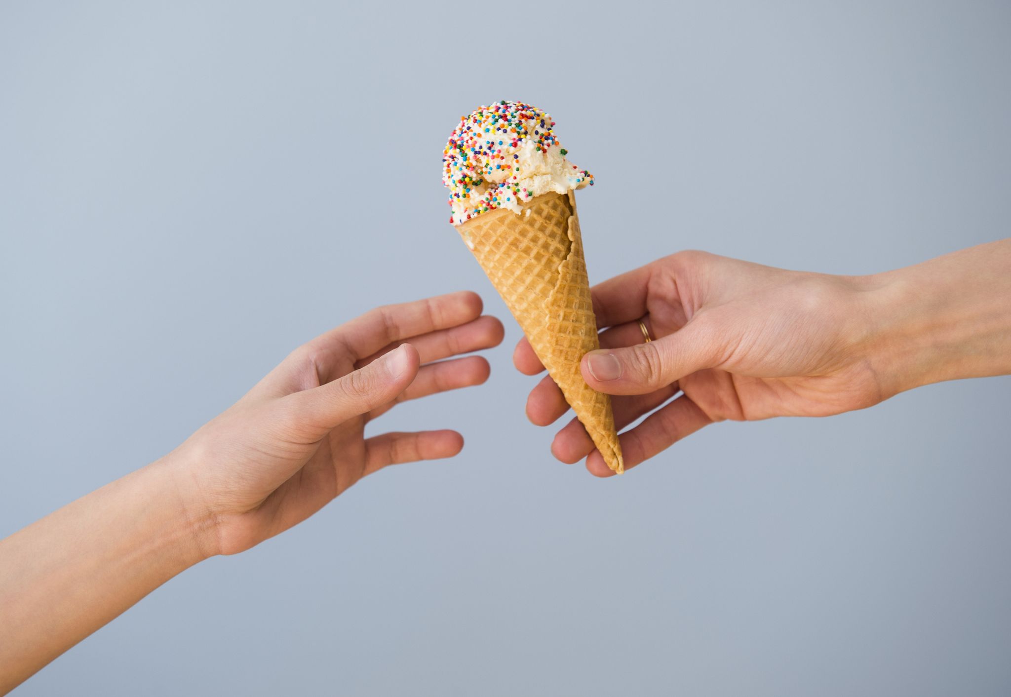 woman reaching for ice cream