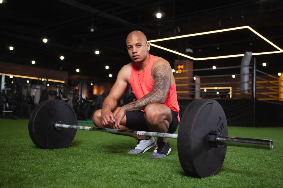 handsome african sportsman working out at the gym