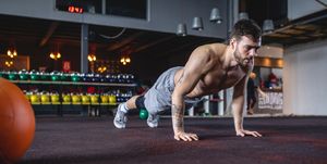 Handsome cross-fit athlete doing pushups