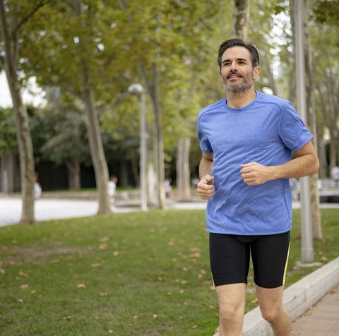 handsome fit middle aged man of hispanic ethnicity exercising outdoors