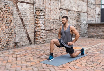 handsome young man working out in his backyard