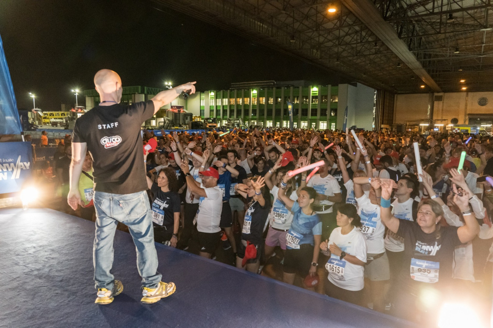 a person standing in front of a crowd of people