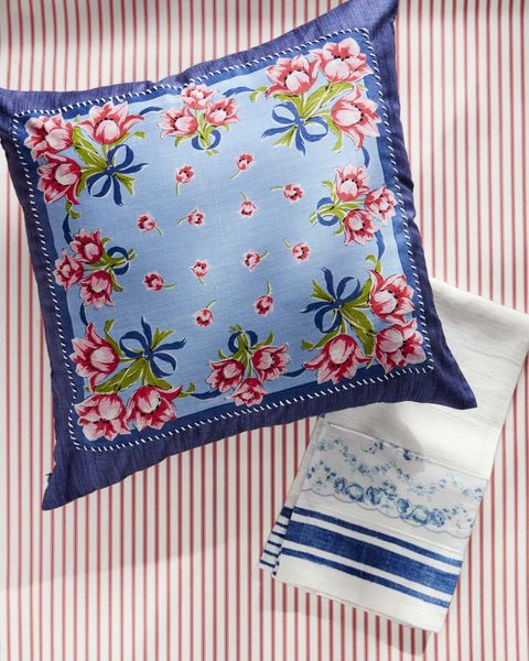 hand stitched tea towel and pillow with floral design