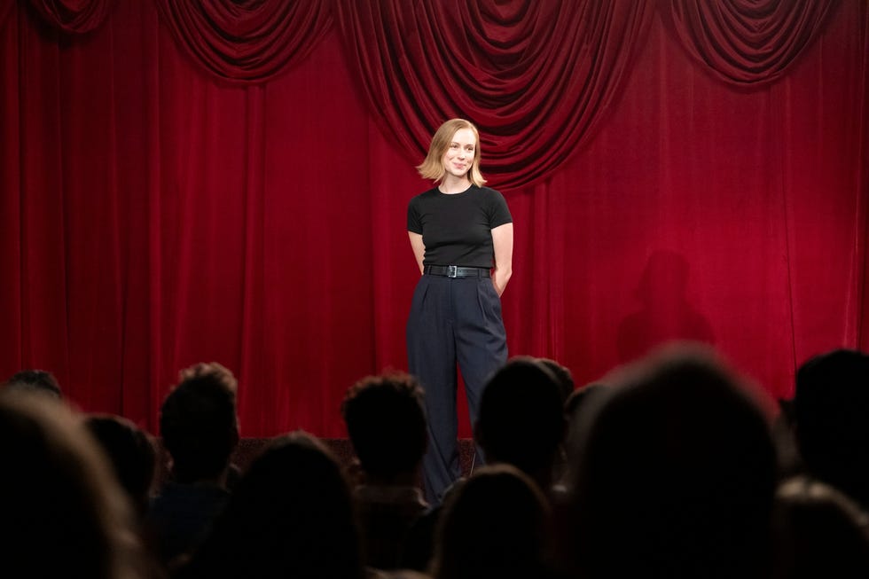a person standing on a stage