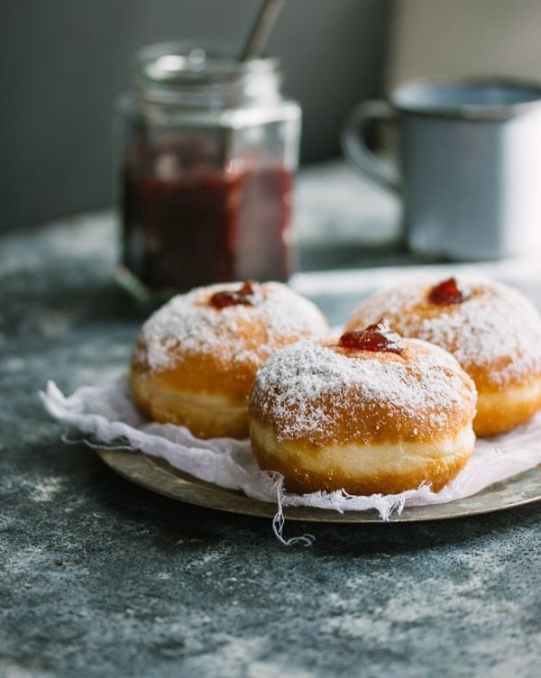 jelly doughnuts on plate with cloth
