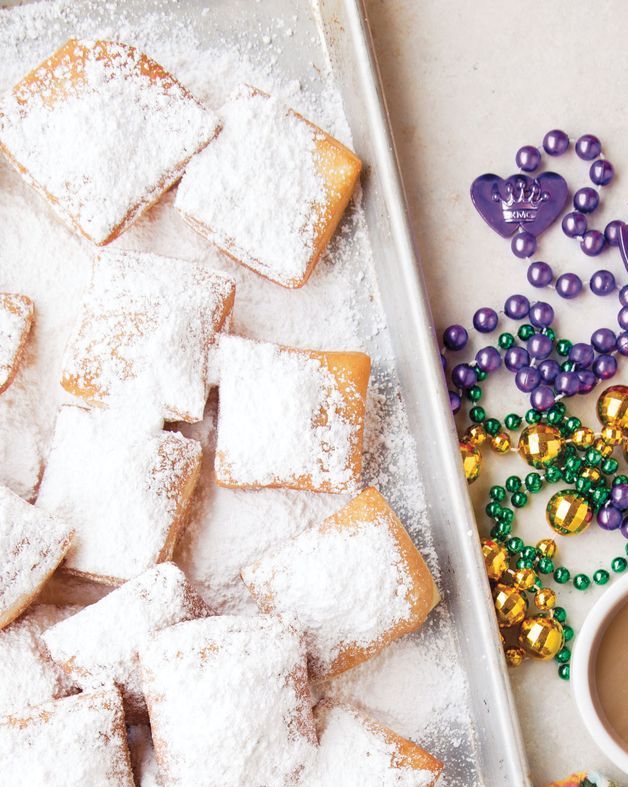 overnight beignets on sheet tray with beads and coffee