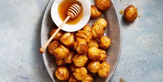 hanukkah honey balls on a serving platter