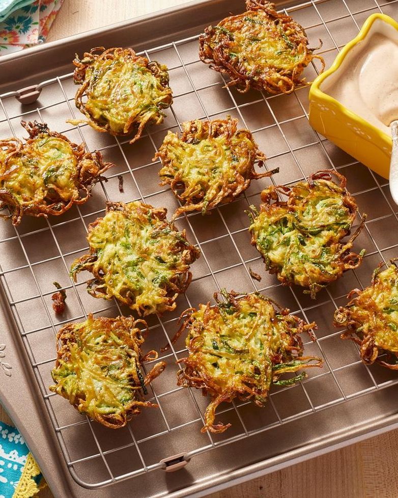 zucchini fritters on sheet tray with wire rack