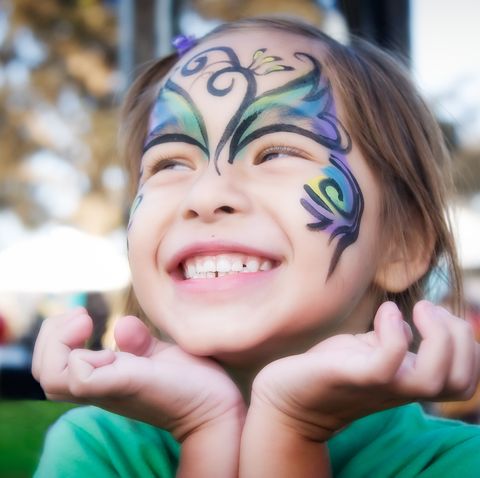 girl smiling with face paint