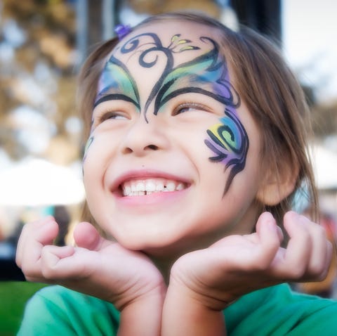 girl smiling with face paint