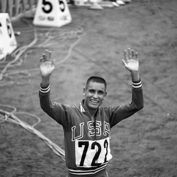 olympian billy mills waving to crowd