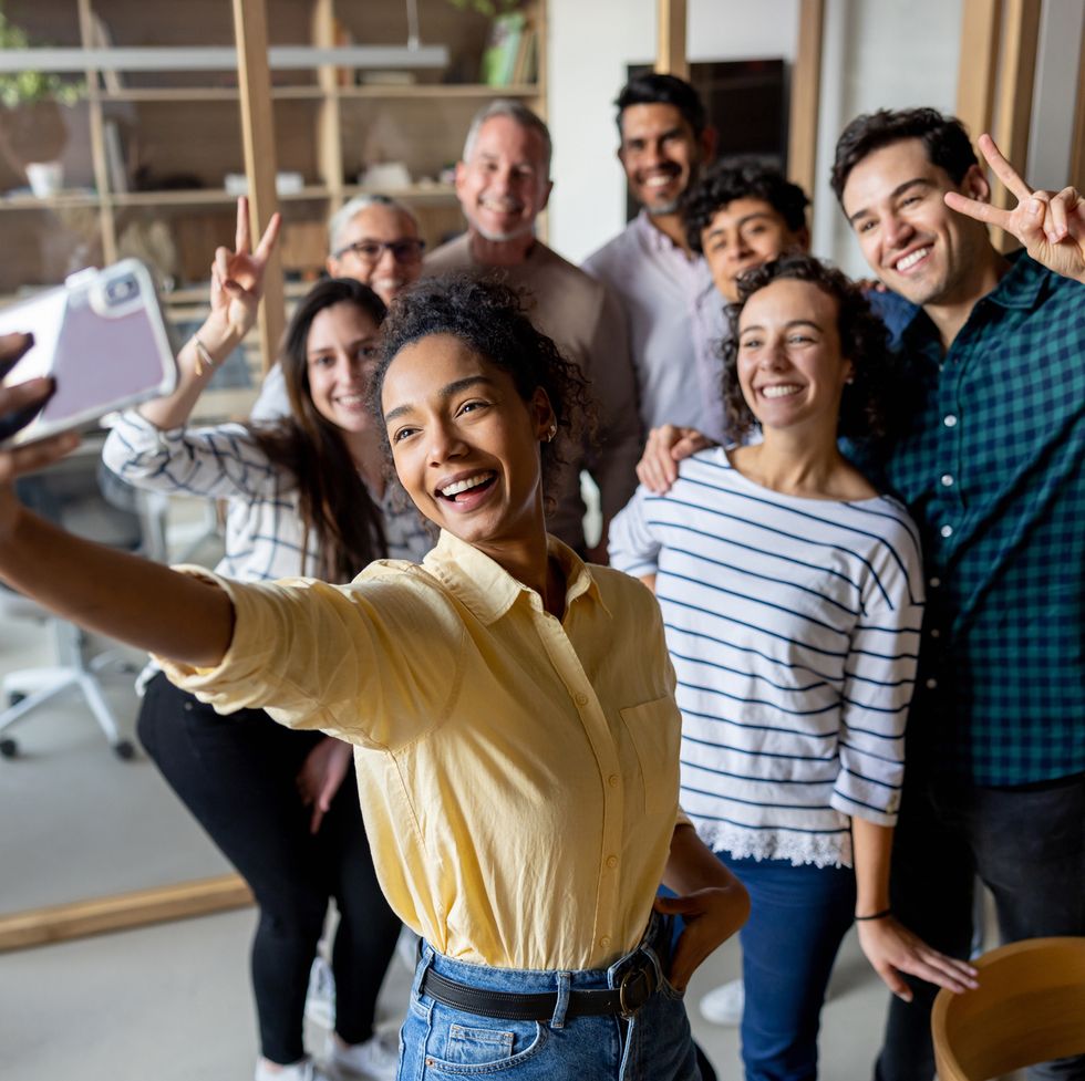 happy business team taking a selfie at the office