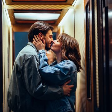 happy couple kissing in the elevator