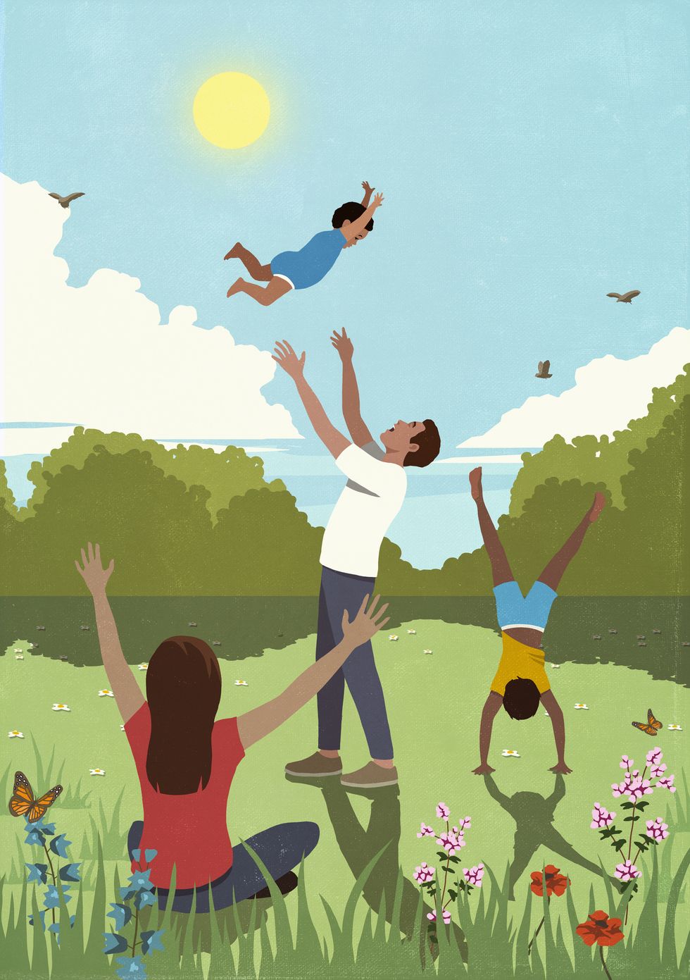 happy family playing in sunny, idyllic summer meadow