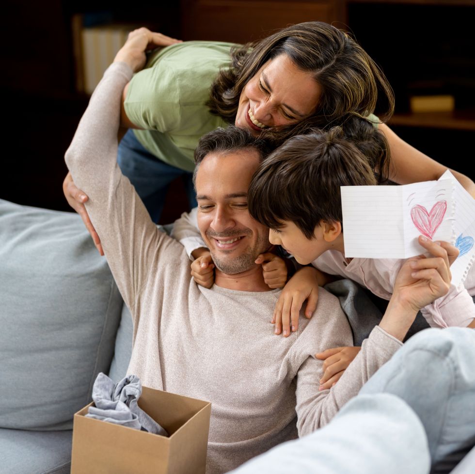 happy father opening his gift for father's day
