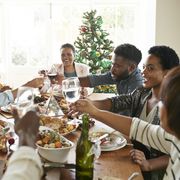 happy friends and family toasting drinks at home, how to set boundaries around diet culture talk
