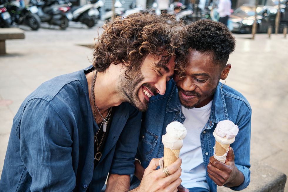 happy gay couple enjoying ice cream