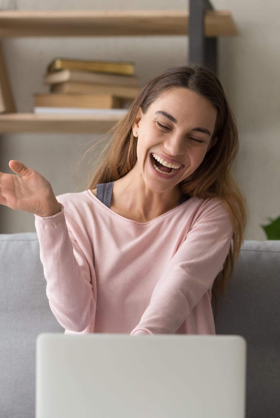 games to play on zoom - Happy girl waving having video call on laptop