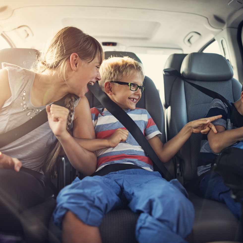 happy kids travelling by car