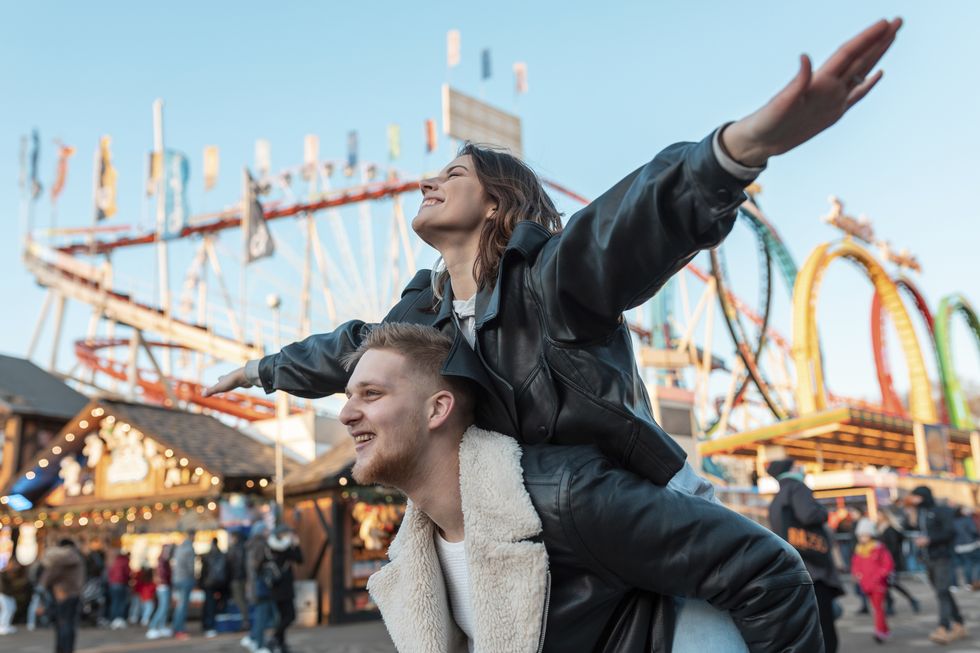 couple having fun at amusement park