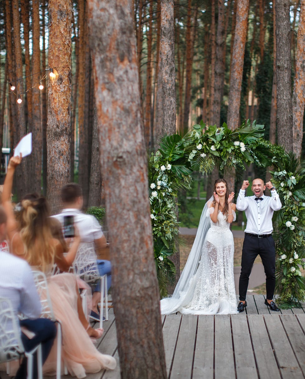 happy newlyweds at the outdoor wedding reception