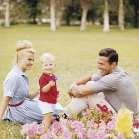 happy retro family relaxing in garden
