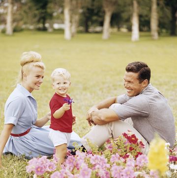 happy retro family relaxing in garden