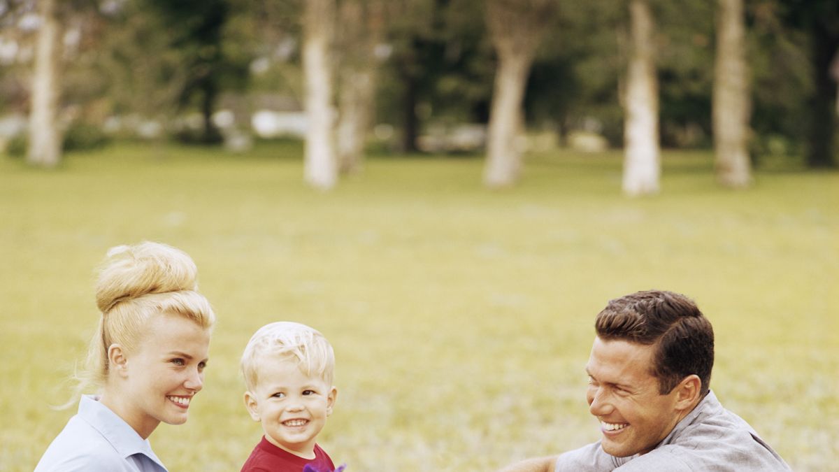 happy retro family relaxing in garden