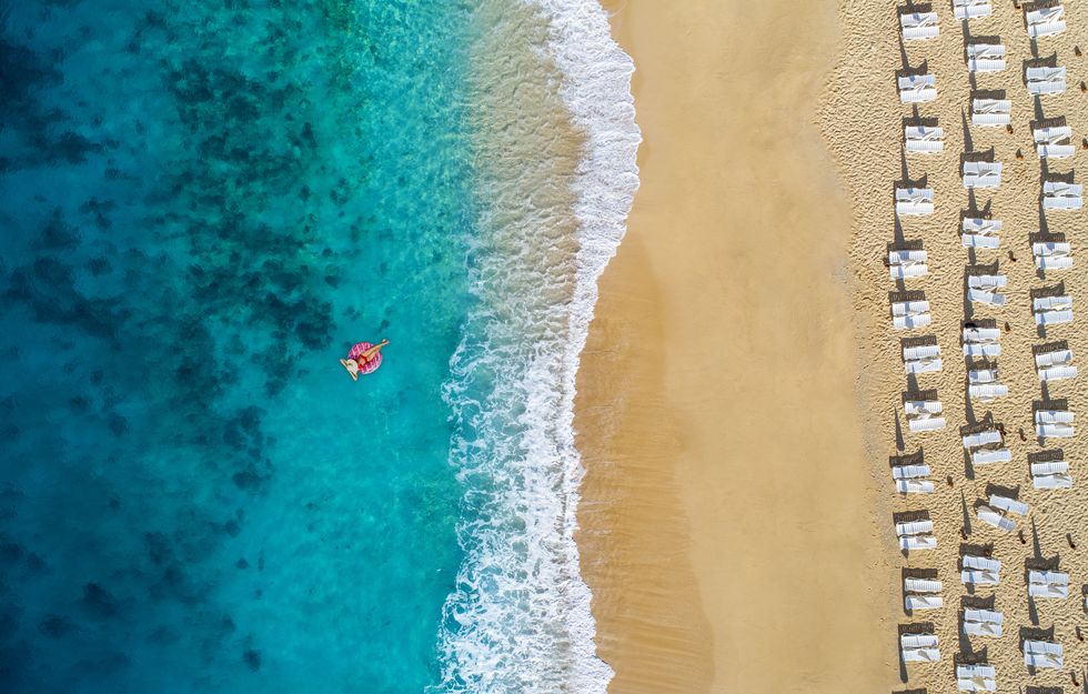 happy woman enjoying at sea on summer