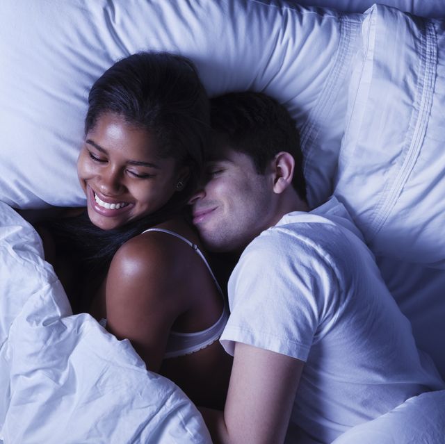 happy young couple in bed