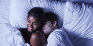 happy young couple in bed