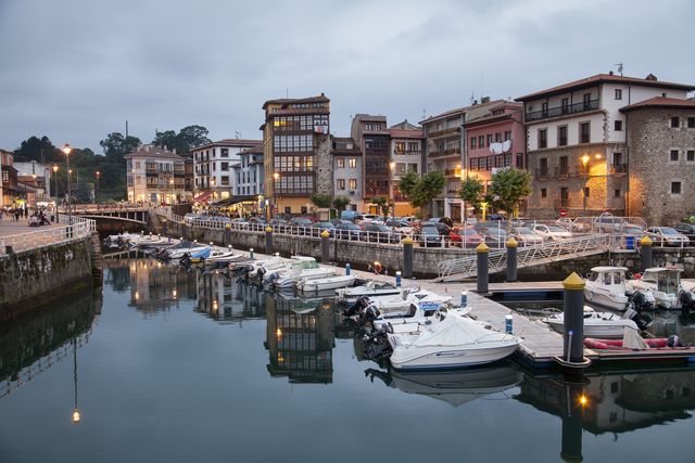 harbor and village of llanes illuminated at night
