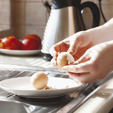 Hard-boiled eggs being shelled