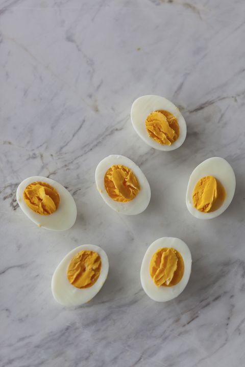 hard boiled eggs cut in half on the white marble surface