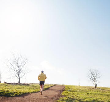 Jogger running up hill.