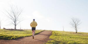 Jogger running up hill.