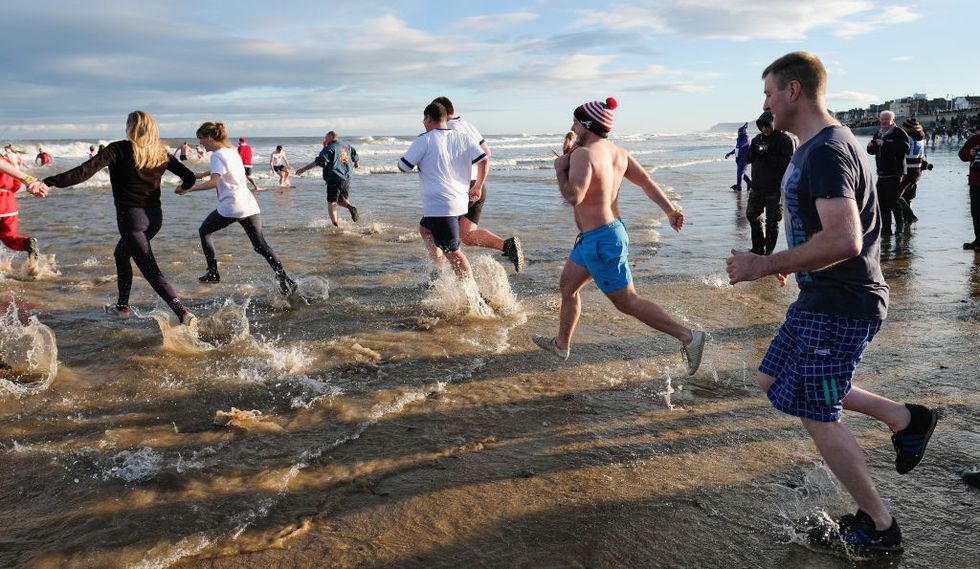 hardy bathers take to the north sea for boxing day dip