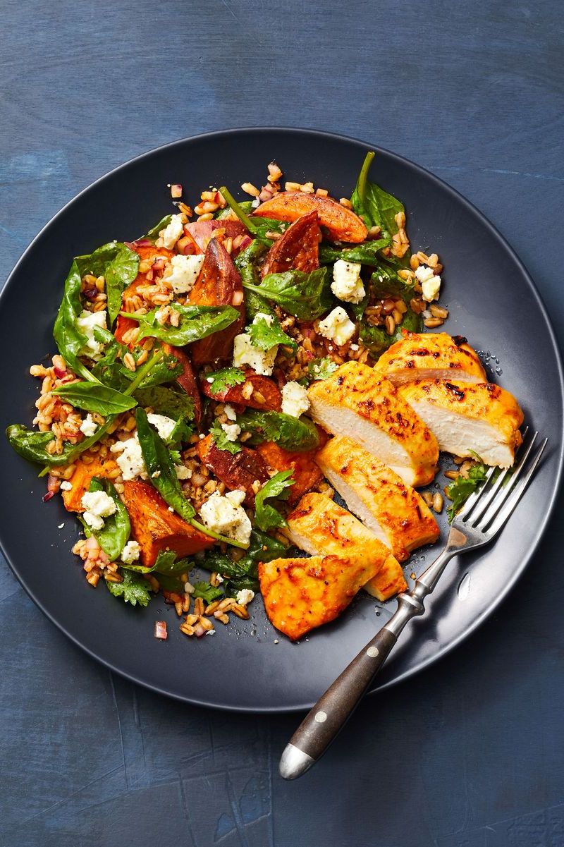 harissa chicken and farro salad on a slate gray background