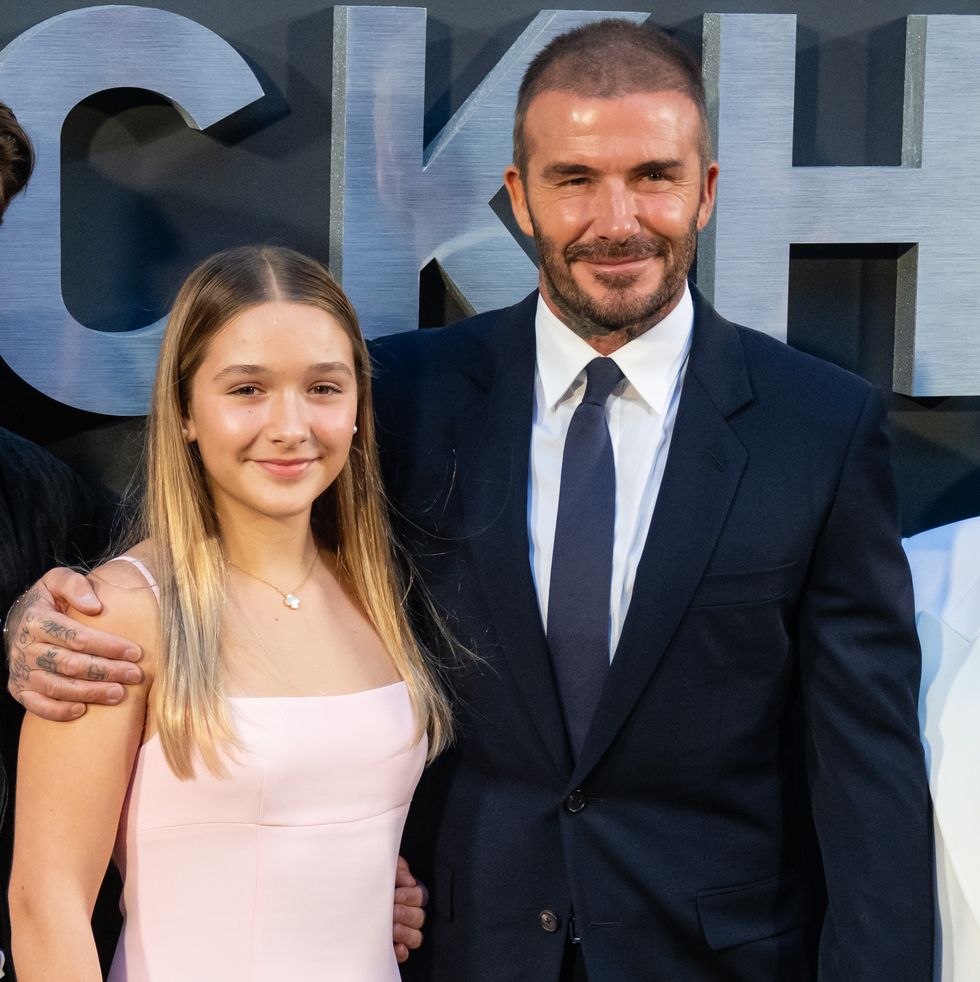 david beckham embracing his daughter harper with his right arm at a premiere event