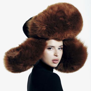 a person wearing a large furry hat