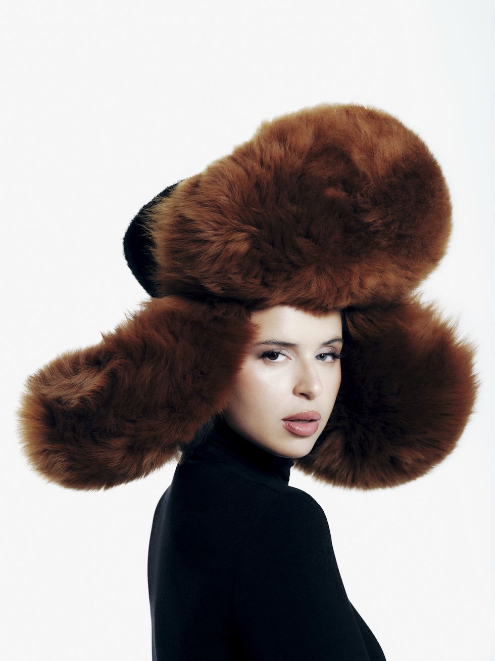 a person wearing a large furry hat