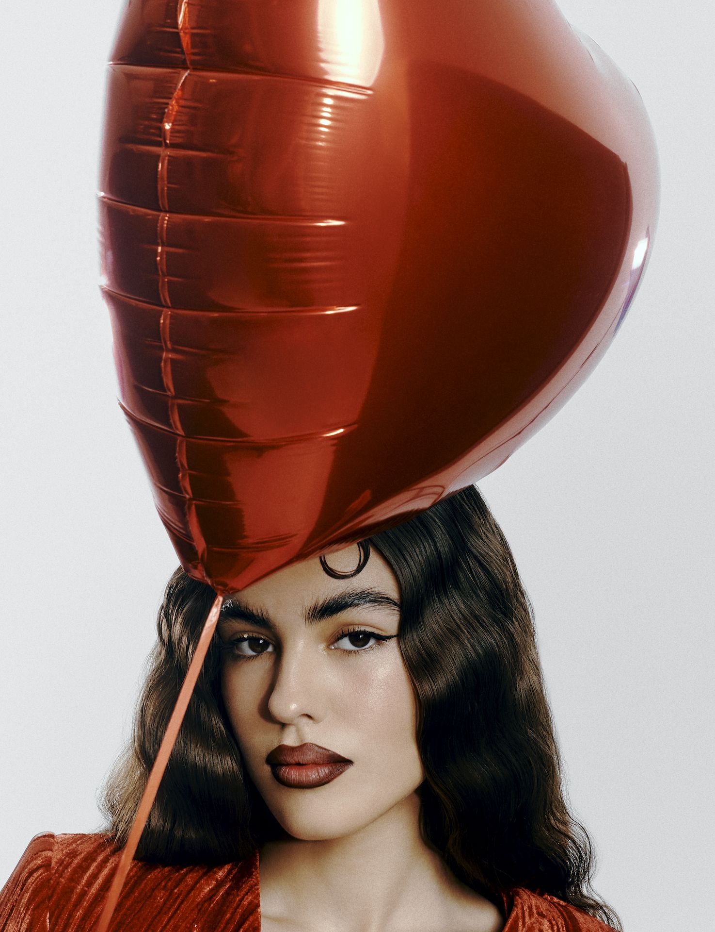 a person with a red balloon over the head