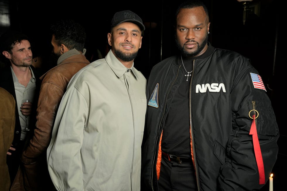 a couple of men posing for the camera