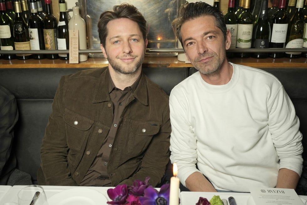 two men sitting at a table