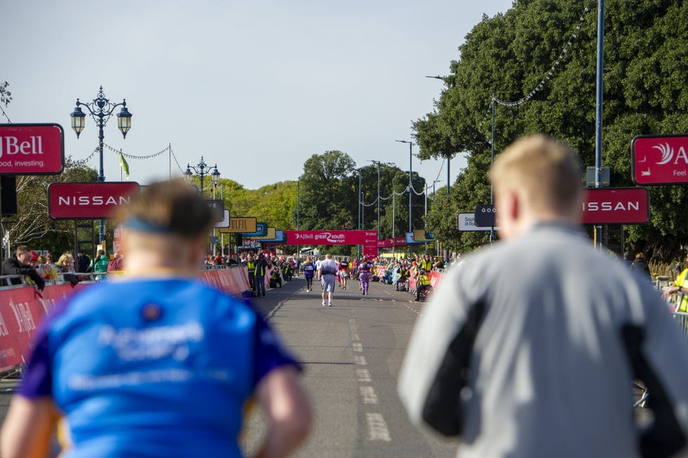 a vibrant street scene depicting a running event