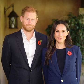 two individuals in formal attire standing close together two individuals in formal attire standing close together