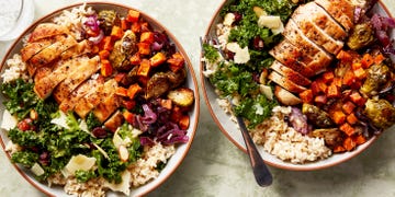 chicken, kale salad, and roasted sweet potatoes in a rice bowl