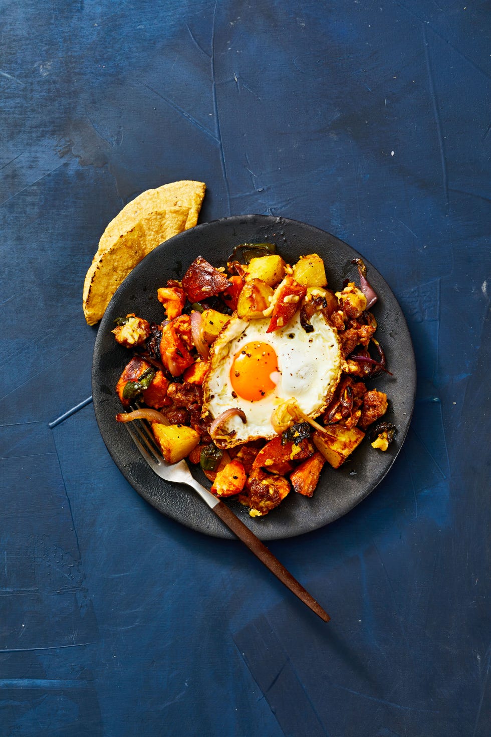 roasted potato and chorizo hash with a fried egg