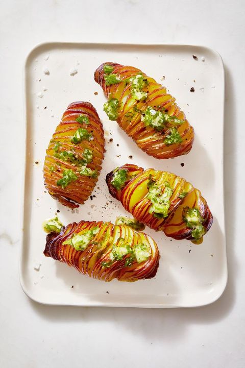 hasselback potatoes served on a white plate