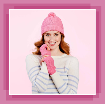 a model wearing a pink hat and wrist warmers